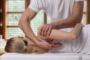 Physical Therapist Rockville, MD- therapist stretching womans back