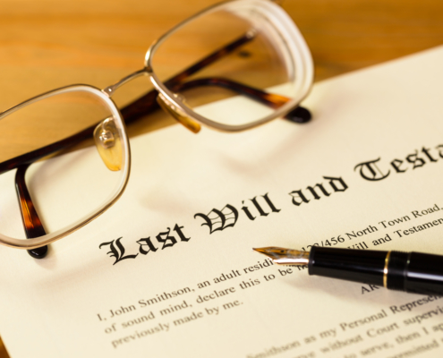 How An Estate Planning Lawyer Can Help - Last will and testament with pen and glasses concept for legal d